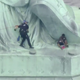 Patricia Okounou being arrested by police rescuers on the Statue of Liberty